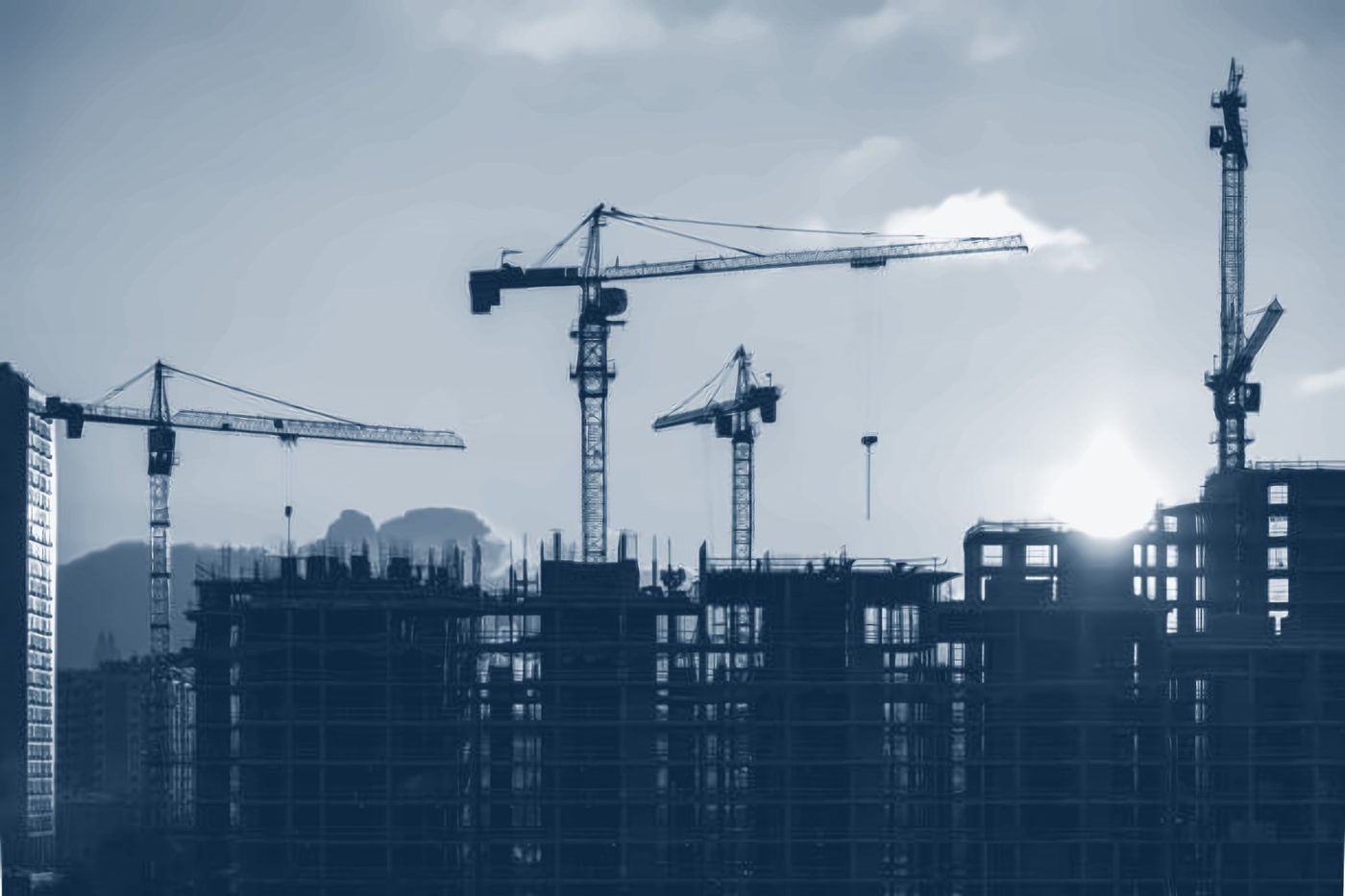 Tower cranes over buildings under construction